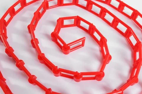 Red plastic chain on a white background Stock Photos