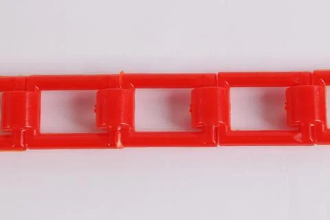 Red plastic chain on a white Stock Photos