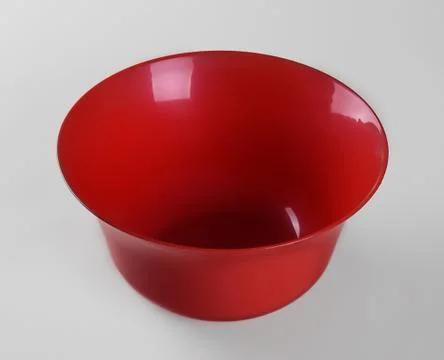 Red plastic deep dish isolated on white background Фото