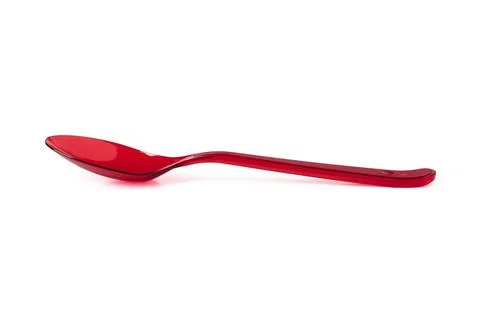 Red plastic disposable spoon Stock Photos
