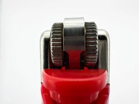 Red plastic lighter on white background close up macro side view Stock Photos