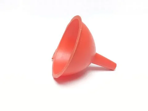 Red plastic liquid funnel isolated on white background 스톡 사진