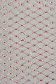 Red Plastic Net Mesh on Gray Background Stock Photos