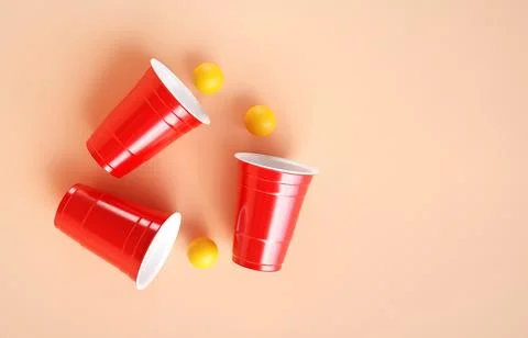 Red plastic party cups on bright background Stock Illustration