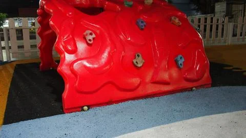 Red plastic playground climbing structure Fotos Stock