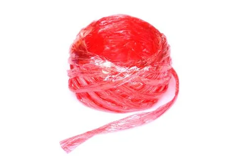 Red plastic rope or string roll isolated on white background. Concept of packagi Stock Photos