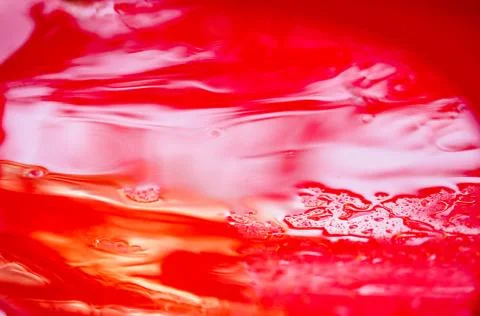 Red plastic surface in water, abstract background Stock-Fotos