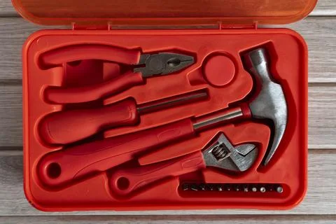 Red Plastic Tool Kit with Essential Hand Tools Foto stock