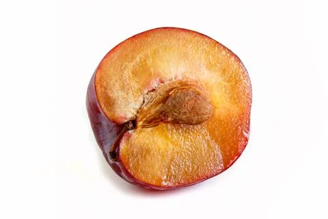 Red plum cut with a bone Stock Photos