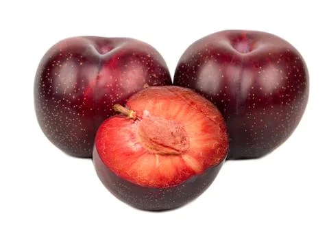 Red plum with half Stock Photos