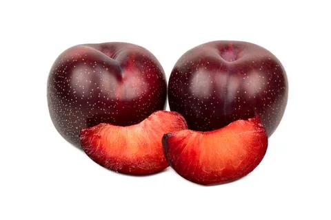 Red plum with slice Stock Photos