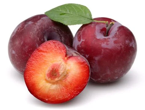 Red plums with leaf on white background Stock-Fotos