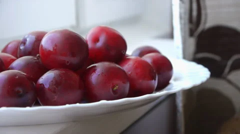 Red Plums On The White Plate Stock Footage 65442793