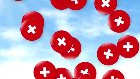 Red Plus Symbol Spheres Falling Against a Blue Cloudy Sky Stock Footage 340381831