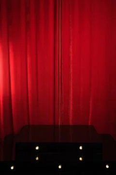Red podium on a background of red drape curtains Stock Photos