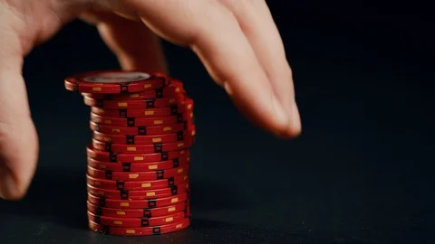 Red poker Chip stack sliding out and sliding away onto black background Stock Footage 101805503