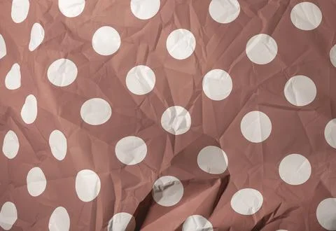 Red polka dot paper texture background. White circle pattern on crumpled su.. Stock Photos