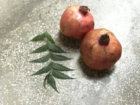 Red Pomegranate On Floor Stock Photos