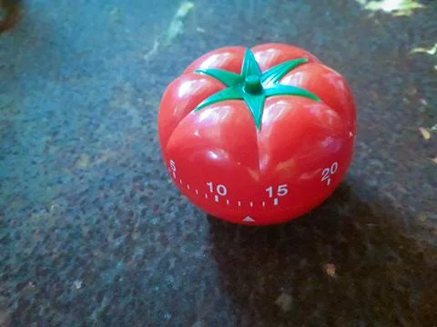 Red Pomodoro timer to help in concentration, improve productivity. Stock Photos