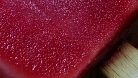 Red Popsicle Defrosting Macro Stock Footage 75739976