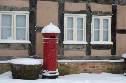Red post box in snow Stock Photos
