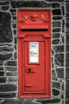 Red post box in wall Stock Photos