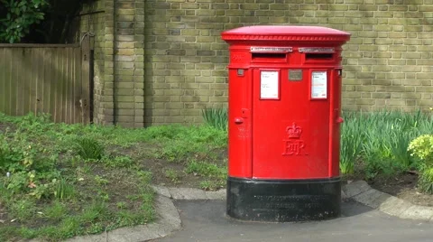 Red post mail box spring sunshine Stock Footage 48401336