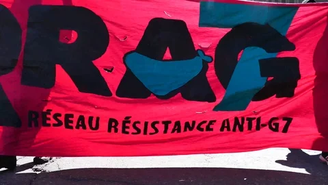 Red poster of protesters coming fastly in the camera direction Stock Footage 95266279