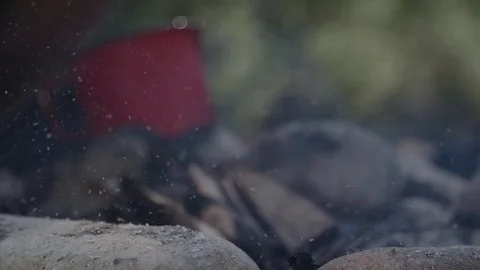 Red pot on small camp fire 動画素材 76737423