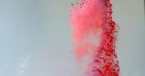 Red Powder erupt on light gray background Stock-Footage 98212804