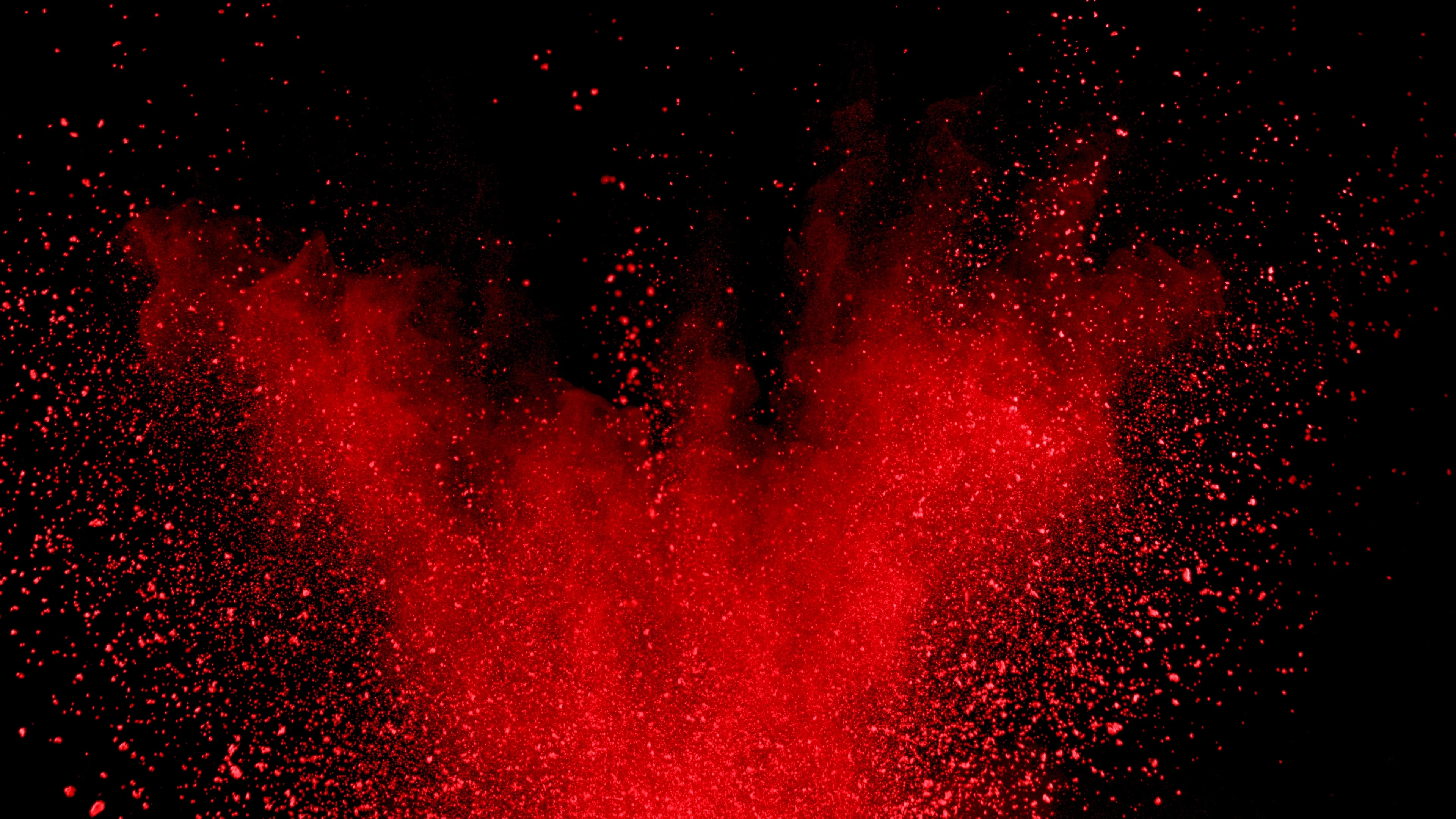 Red powder exploding on black background... | Stock Video | Pond5