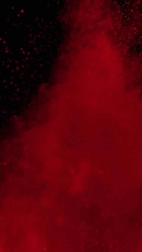 Red Powder Exploding on Black Background Vertical Video 4k Stock Footage 320070380