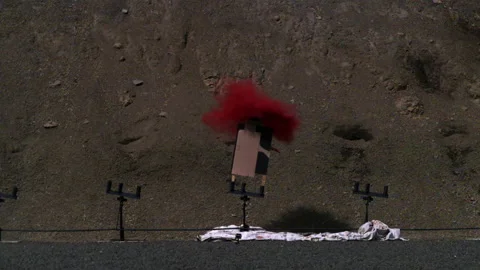 Red powder exploding at shooting range - Reenactment Stock Footage 202914823