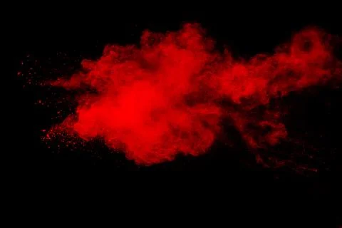 Red powder explosion on black background. Stock Photos