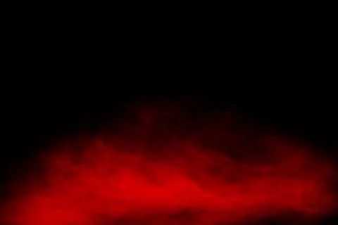 Red powder explosion cloud on black background. Stock Photos
