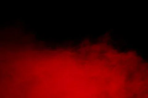 Red powder explosion cloud on black background. Stock Photos