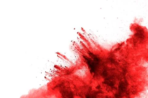Red powder explosion on white background. Red powder explosion. Stock Photos