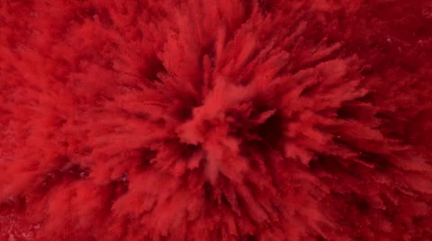 Red powder/particles fly after being exploded.  4K 30fps. Slow Motion. Stock Footage 55536811