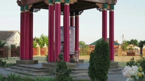 Red prayer Buddhist drum wheels. Russia, Elista - June 2019 Stock Footage 130347272