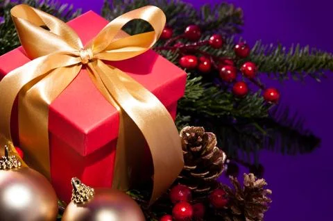 Red present box in a christmas setting close up shoot Stock Photos