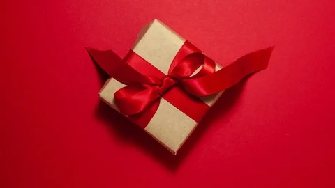 Red present brown paper box on red stop motion animation Stock Footage 123809384