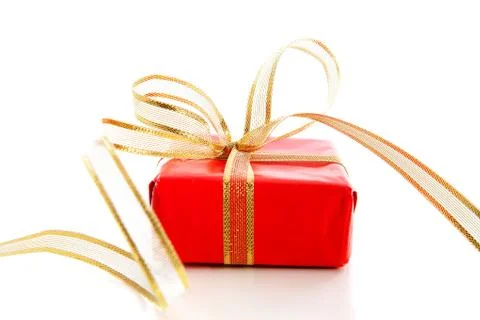 Red present with golden bow Stock Photos