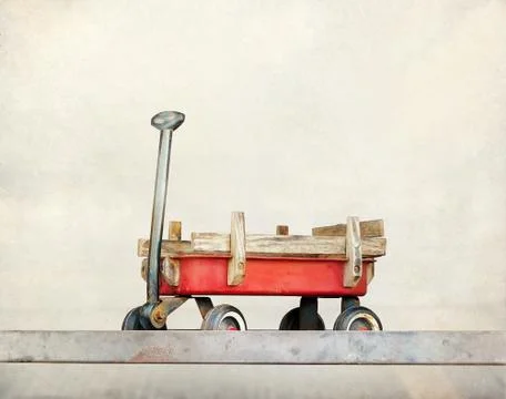 Red pull trolley toys, old rusty wagon, Vintage color tone on paper grain 库存照片