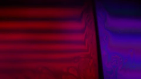 Red Purple multi-colored liquid in macro, color change and reflection Stock Footage 279860894
