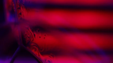Red purple reflections of liquid in macro, dark horror background Stock Footage 279860781