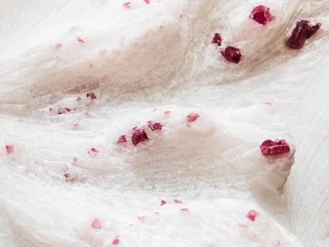 Red purple ruby crystals in quartz rock close-up Stock Photos