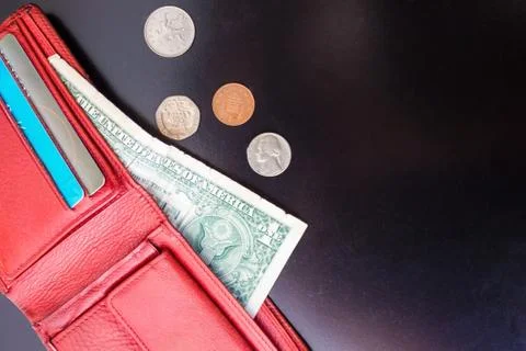 Red purse with small money. Stock Photos