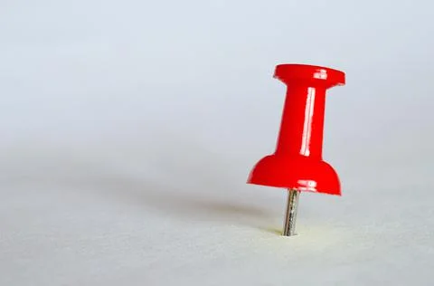 Red push pin. Closeup of red thumbtack Stock Photos