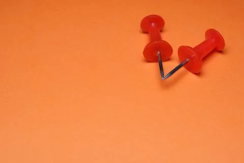 Red push pins create a unique shape Stock Photos