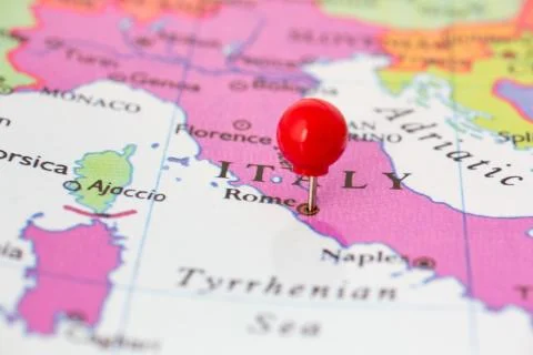 Red pushpin on map of italy Stock Photos